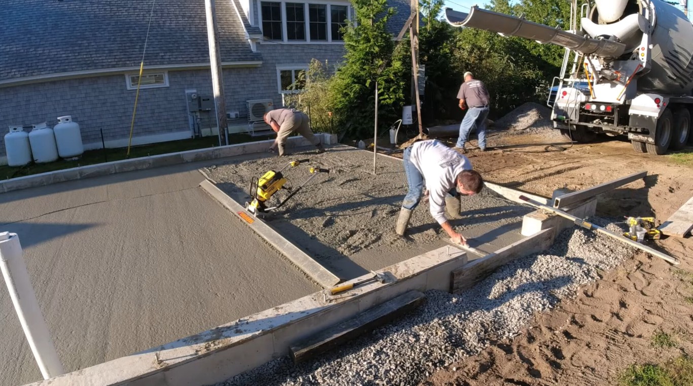 Professional concrete crew installing driveway in San Clemente